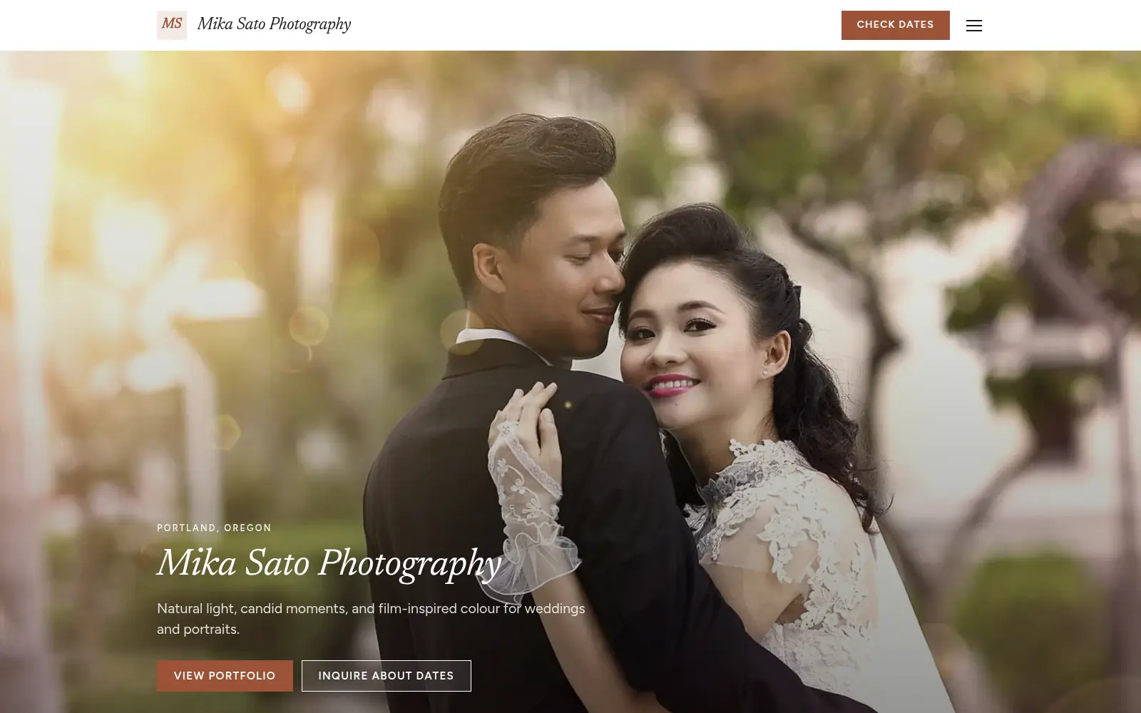 The Mika Sato Photography example site: a full-screen photo of a bride and groom embracing in warm light, with the name below their faces