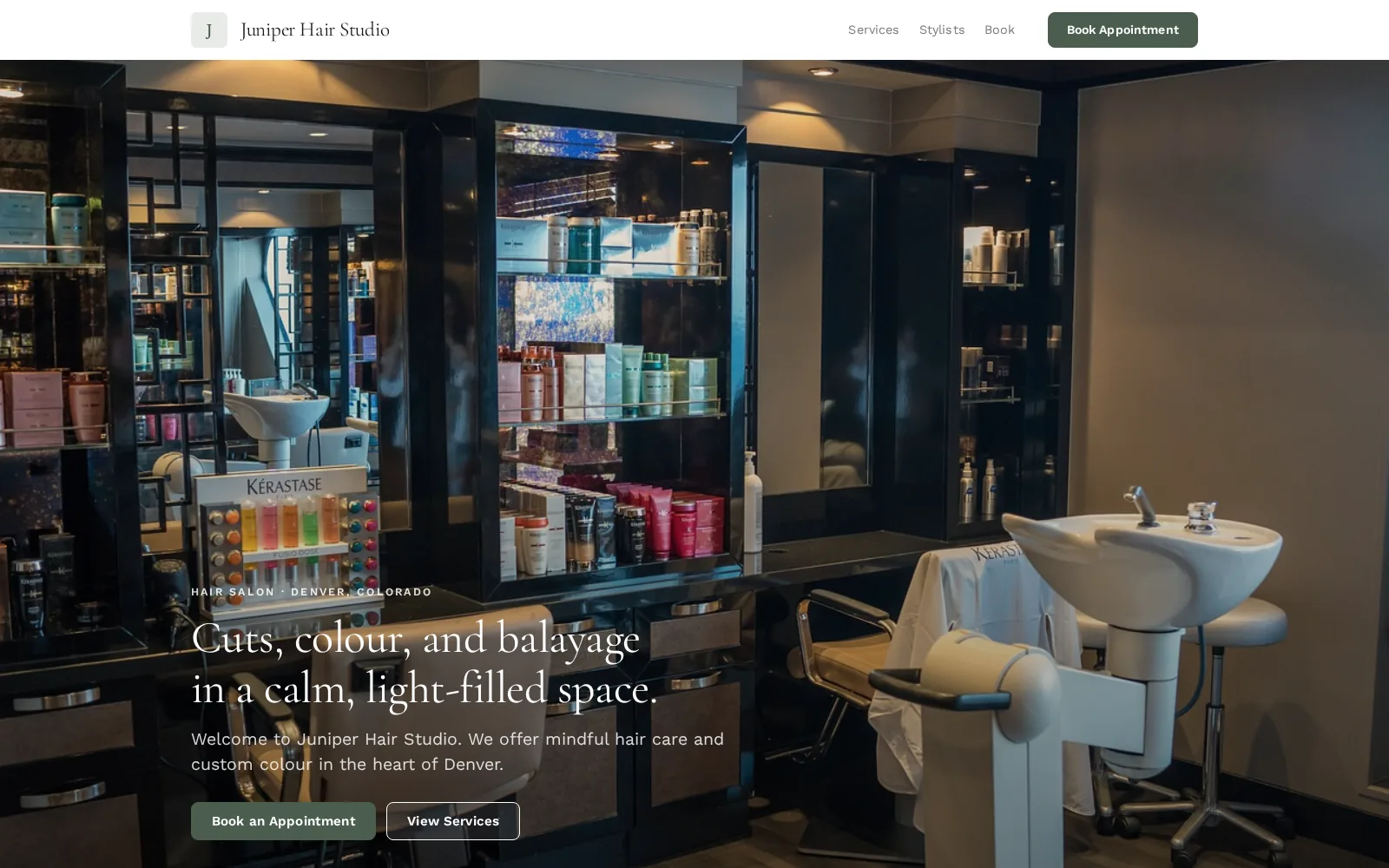 The Juniper Hair Studio example site: a full-width photo of a modern salon’s wash basins and product shelves under the headline about cuts, colour and balayage